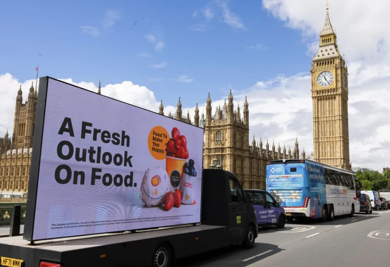 UK berry growers challenge junk food ad loophole in outdoor spaces near children across streets-image